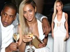 Beyoncé shows some skin in knit dress as she clinks champagne flutes with Jay-Z at his 40/40 tenth anniversary party